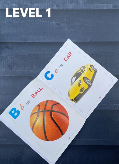 Flashcards with a basketball and a car on a wooden surface